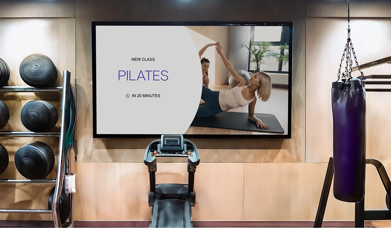 A digital display in a fitness center displaying a special offer
