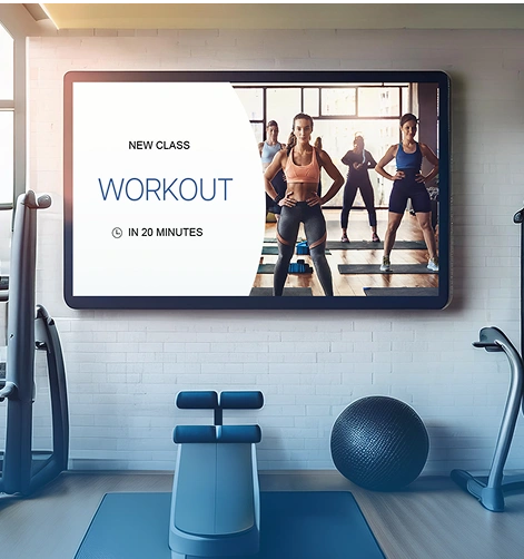 Digital signage in a fitness center showing the class schedule – workout class starts in 20 minutes.