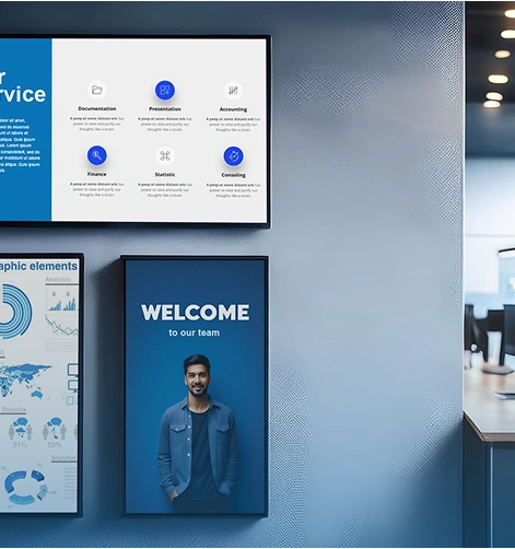 Digital signage displays managed by Displio software displaying corporate information, statistics, and a welcome for a new employee.